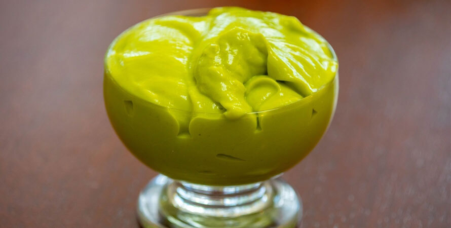 avocado seed tea preparation with sliced avocado pit boiling in water for anti-inflammatory benefits